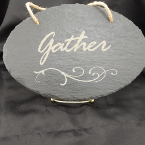 Custom sign with gather written on it