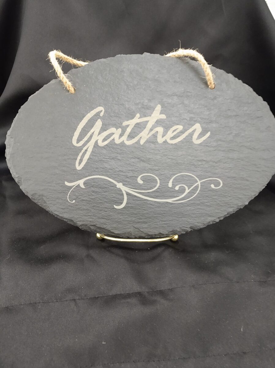 Custom sign with gather written on it